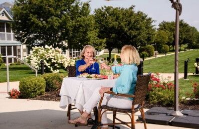 Two friends enjoy lunch together.